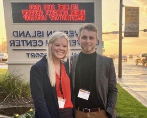 Brach Herzig and Julia Schaffer pose outside the NASA Workshop where they presented their research.